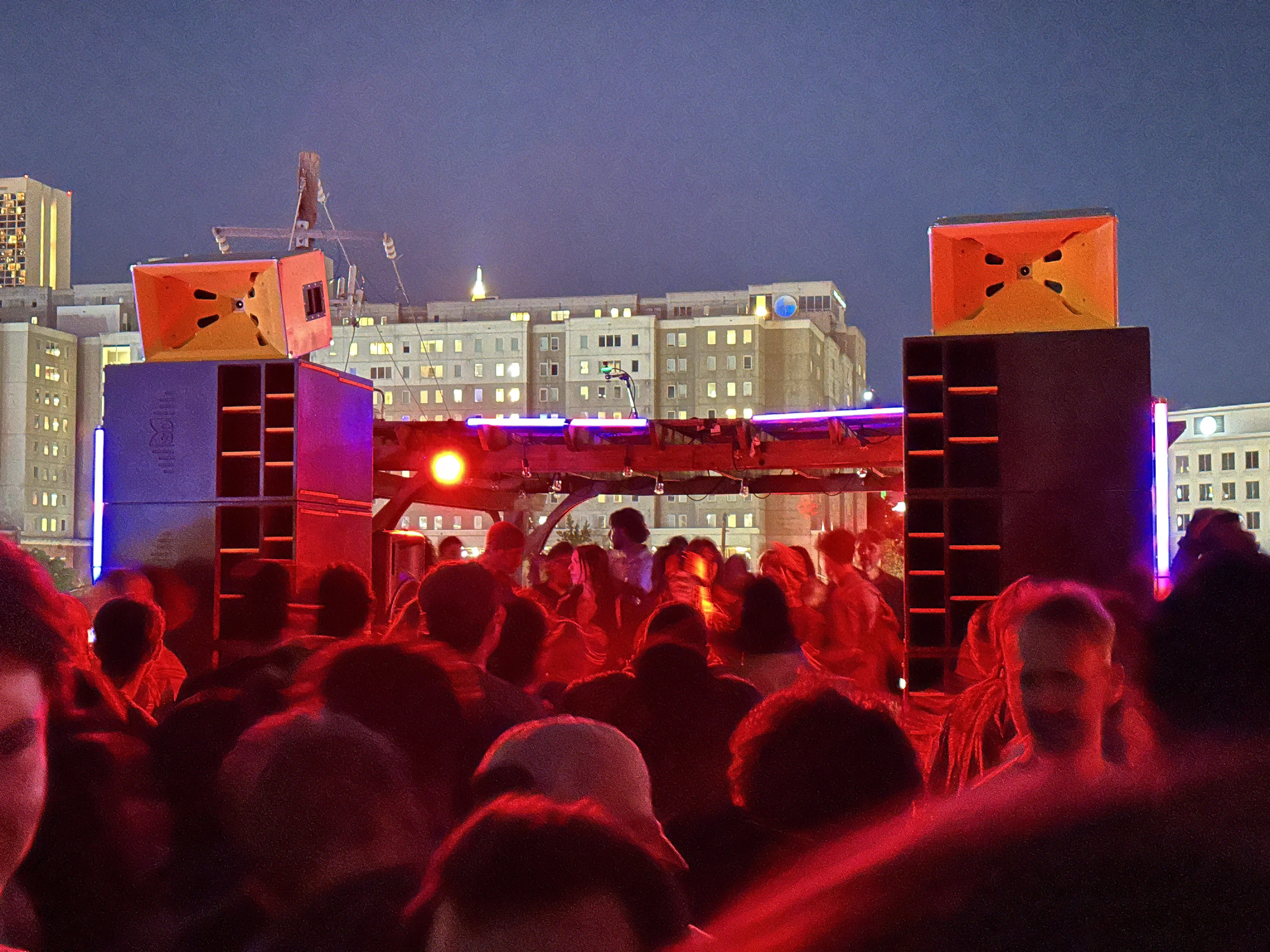 Sound Decisions system with city skyline and night crowd